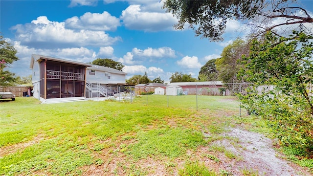 2333 Cheshire Pl, Lakeland, FL 33810 - fenced backyard with a sunroom and a storage shed