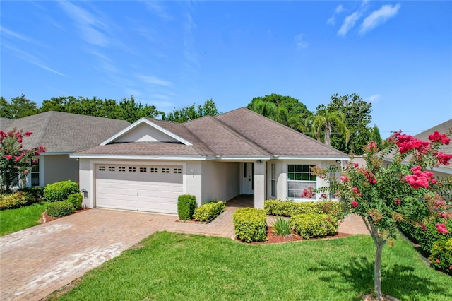 3806 Osprey Pointe Cir, Winter Haven, FL 33884 - single story home featuring an attached garage, a front lawn, and stucco siding