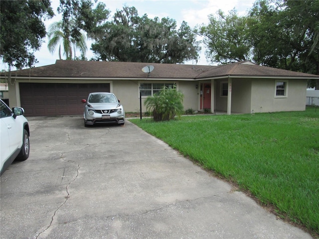 1440 Hackl Blvd, Bartow, FL 33830 - single story home featuring driveway, stucco siding, a garage, and a front lawn
