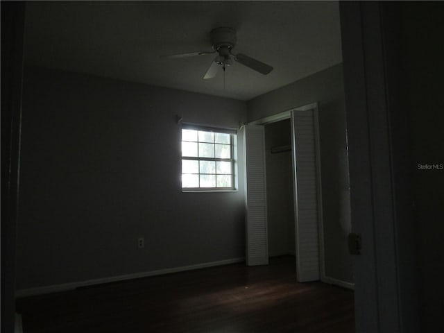 1440 Hackl Blvd, Bartow, FL 33830 - unfurnished bedroom with baseboards, wood finished floors, a closet, and a ceiling fan
