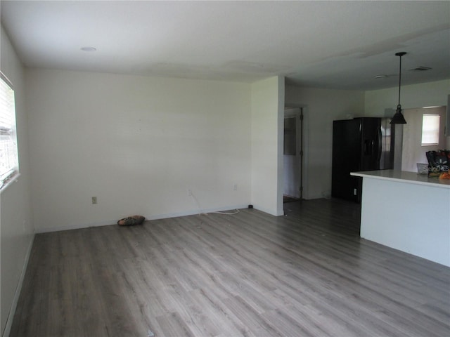 1440 Hackl Blvd, Bartow, FL 33830 - unfurnished living room with wood finished floors and baseboards