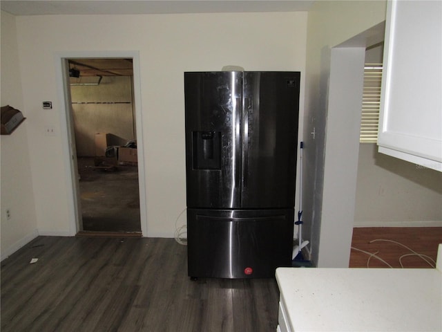 1440 Hackl Blvd, Bartow, FL 33830 - kitchen with black fridge, dark wood-style floors, and baseboards