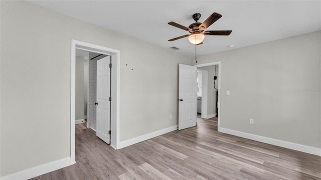 980 S Mill Ave, Bartow, FL 33830 - unfurnished bedroom with wood finished floors and a ceiling fan