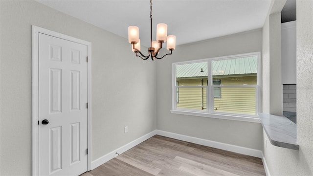 980 S Mill Ave, Bartow, FL 33830 - spare room featuring a chandelier and wood finished floors
