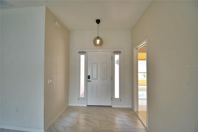 4188 Muirfield Loop, Lake Wales, FL 33859 - entrance foyer featuring light marble finish floors and baseboards