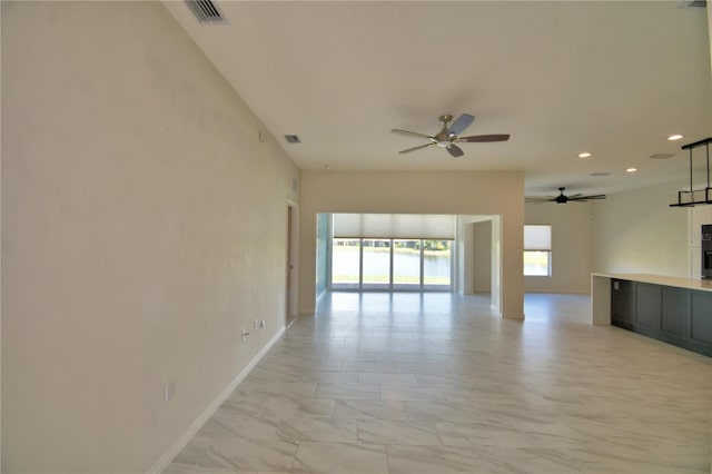 4188 Muirfield Loop, Lake Wales, FL 33859 - unfurnished living room featuring a ceiling fan and recessed lighting