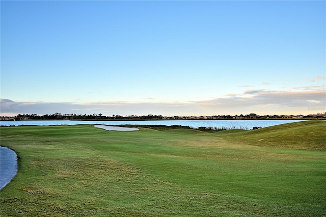 4188 Muirfield Loop, Lake Wales, FL 33859 - surrounding community with golf course view, a yard, and a water view