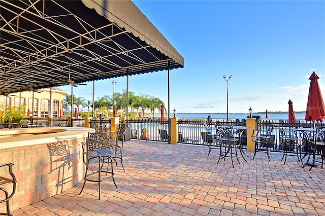 4188 Muirfield Loop, Lake Wales, FL 33859 - view of patio featuring a water view