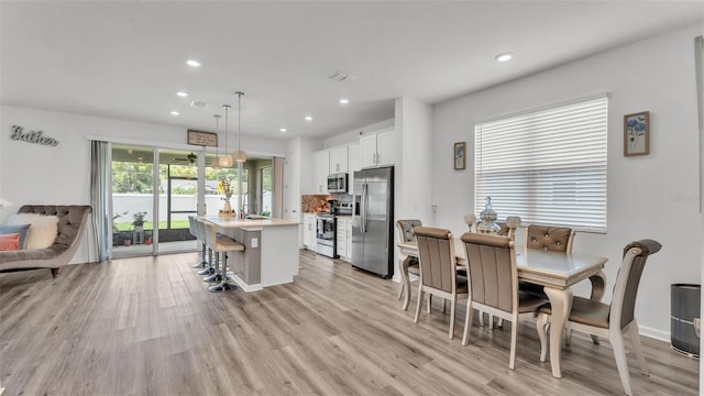 1125 Mattie Pointe Blvd, Auburndale, FL 33823 - dining area featuring recessed lighting and light wood-style flooring