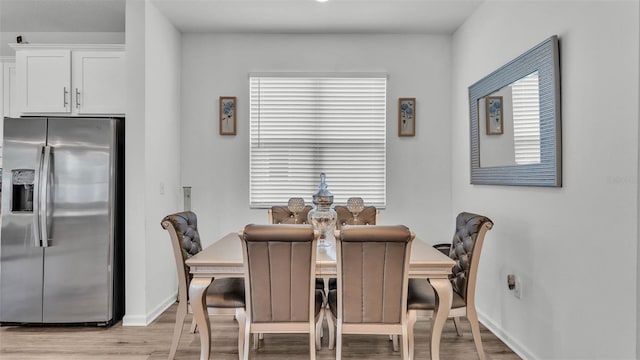 1125 Mattie Pointe Blvd, Auburndale, FL 33823 - dining area featuring light wood-style floors and baseboards
