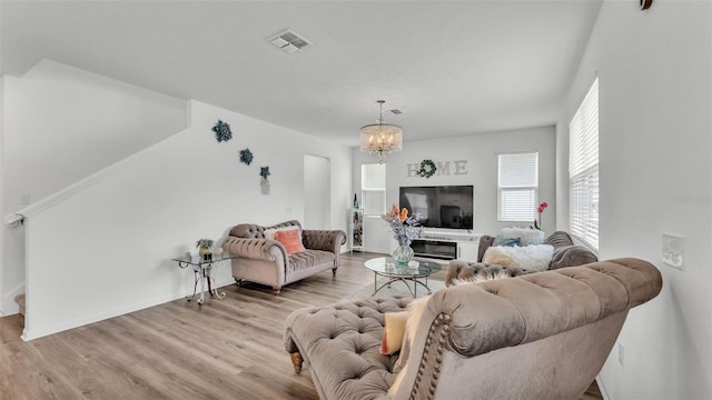 1125 Mattie Pointe Blvd, Auburndale, FL 33823 - living area with wood finished floors and a chandelier