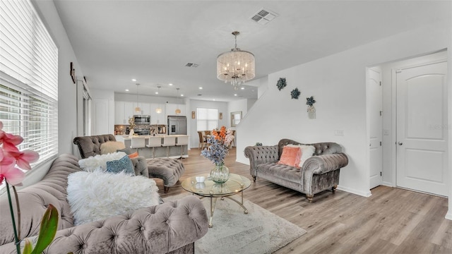 1125 Mattie Pointe Blvd, Auburndale, FL 33823 - living area with a chandelier, light wood-style floors, and recessed lighting