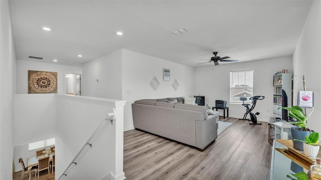 1125 Mattie Pointe Blvd, Auburndale, FL 33823 - living room featuring wood finished floors, a ceiling fan, and recessed lighting