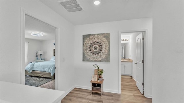 1125 Mattie Pointe Blvd, Auburndale, FL 33823 - hallway featuring light wood-type flooring and baseboards