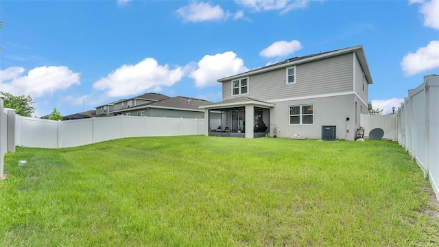 1125 Mattie Pointe Blvd, Auburndale, FL 33823 - rear view of property with a sunroom, a fenced backyard, and stucco siding