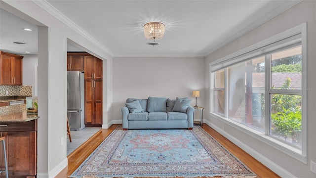 4219 Forest Hills Dr, Lakeland, FL 33813 - sitting room featuring light wood-style floors, crown molding, and recessed lighting