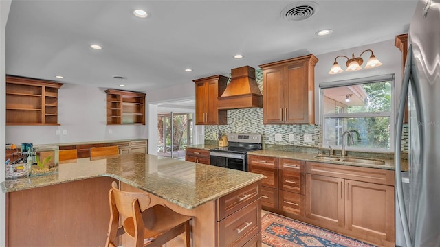 4219 Forest Hills Dr, Lakeland, FL 33813 - kitchen featuring open shelves, stainless steel appliances, custom exhaust hood, backsplash, and light stone counters