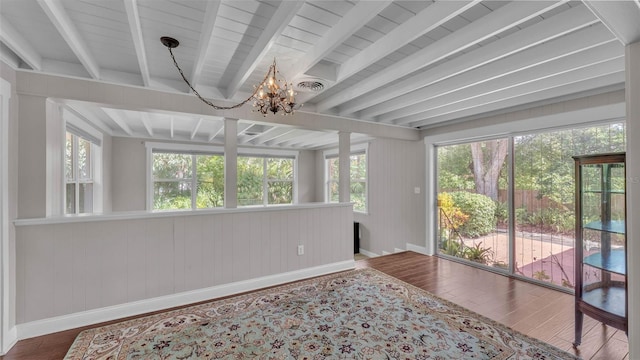 4219 Forest Hills Dr, Lakeland, FL 33813 - unfurnished sunroom with a chandelier, plenty of natural light, and beamed ceiling