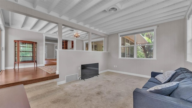 4219 Forest Hills Dr, Lakeland, FL 33813 - carpeted living area with beamed ceiling and a chandelier