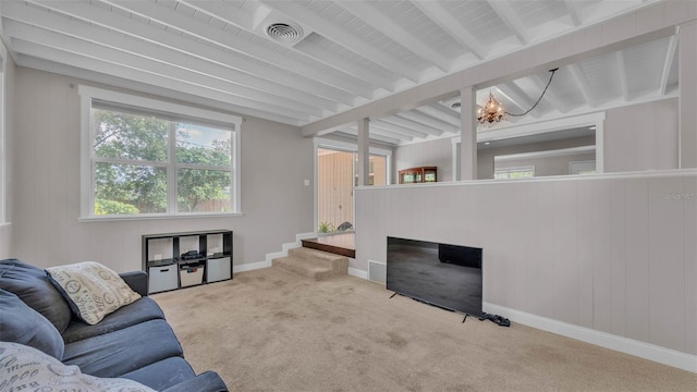 4219 Forest Hills Dr, Lakeland, FL 33813 - living room featuring a chandelier, carpet flooring, beam ceiling, and wooden walls