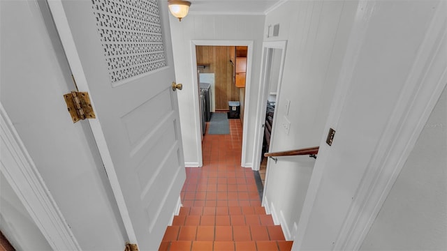 4219 Forest Hills Dr, Lakeland, FL 33813 - hall with dark tile patterned floors and ornamental molding