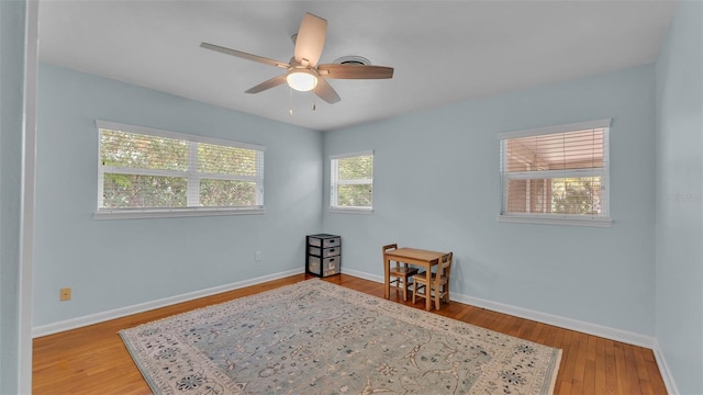 4219 Forest Hills Dr, Lakeland, FL 33813 - unfurnished room featuring a ceiling fan and wood finished floors