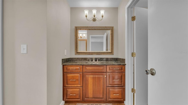 4219 Forest Hills Dr, Lakeland, FL 33813 - bathroom with vanity and a chandelier
