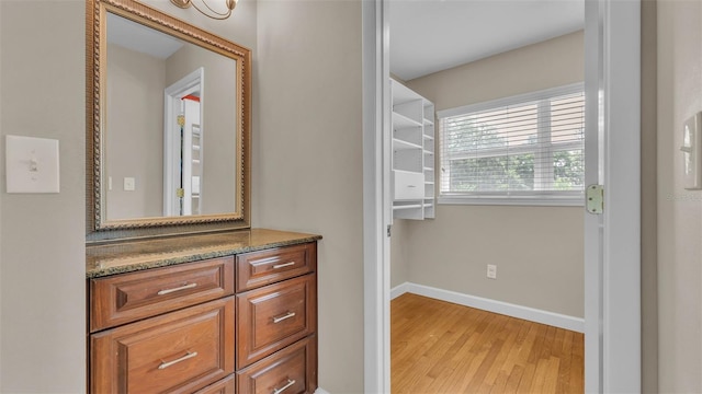 4219 Forest Hills Dr, Lakeland, FL 33813 - bathroom featuring wood finished floors and vanity