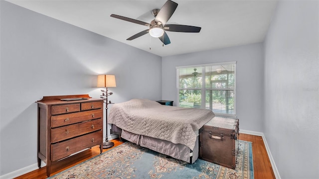 4219 Forest Hills Dr, Lakeland, FL 33813 - bedroom featuring wood finished floors and a ceiling fan