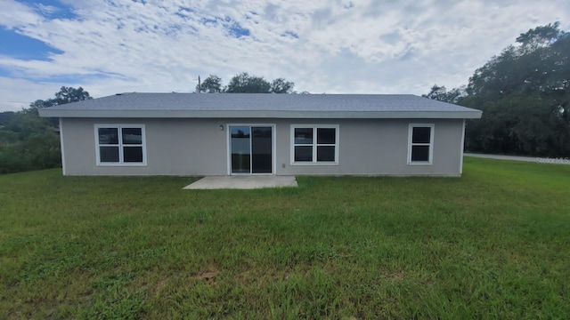 200 Locust Pass, Ocala, FL 34472 - back of house featuring a yard and stucco siding