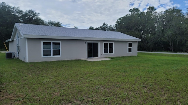 200 Locust Pass, Ocala, FL 34472 - rear view of property with a yard, stucco siding, and a shingled roof