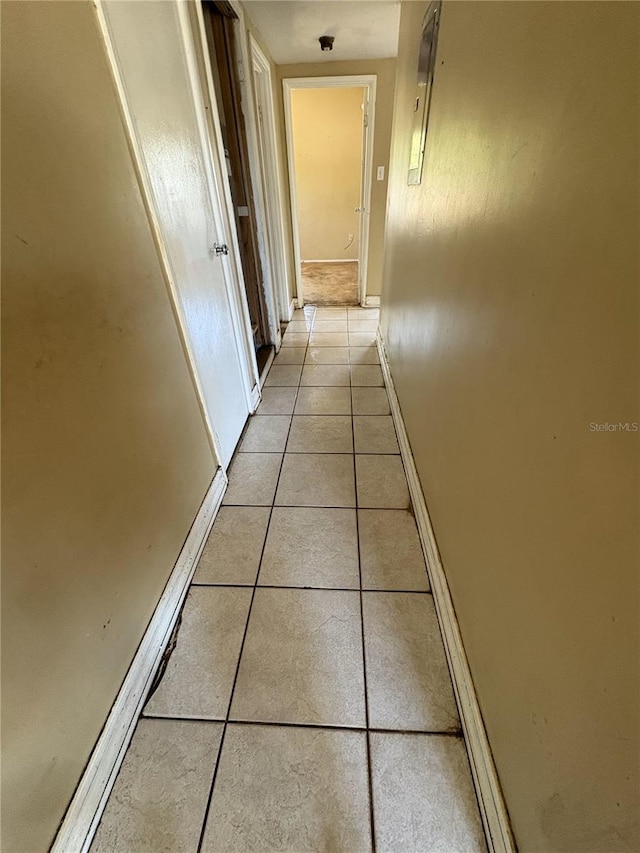 1120 Ivy Ln, Bartow, FL 33830 - corridor with light tile patterned flooring and baseboards