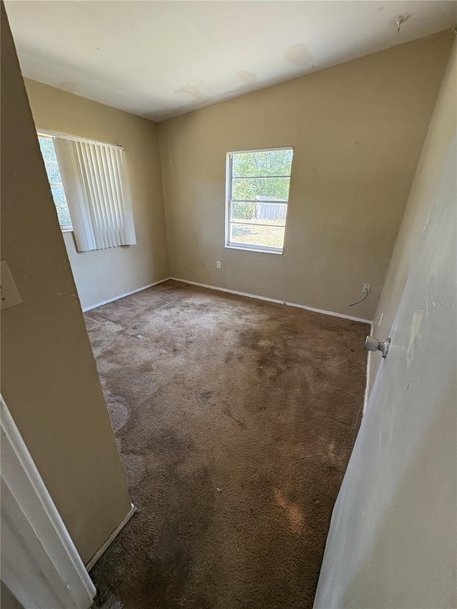 1120 Ivy Ln, Bartow, FL 33830 - carpeted empty room with baseboards