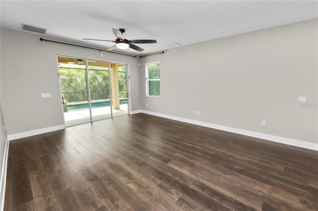 228 Magneta Loop, Auburndale, FL 33823 - unfurnished room with ceiling fan, dark wood-style floors, and plenty of natural light
