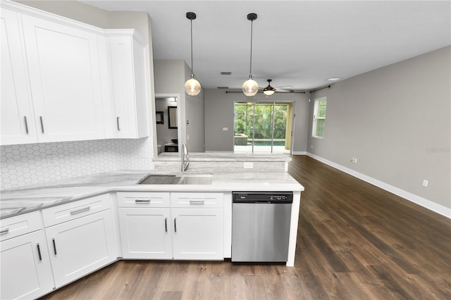 228 Magneta Loop, Auburndale, FL 33823 - kitchen with stainless steel dishwasher, a peninsula, backsplash, ceiling fan, and dark wood finished floors
