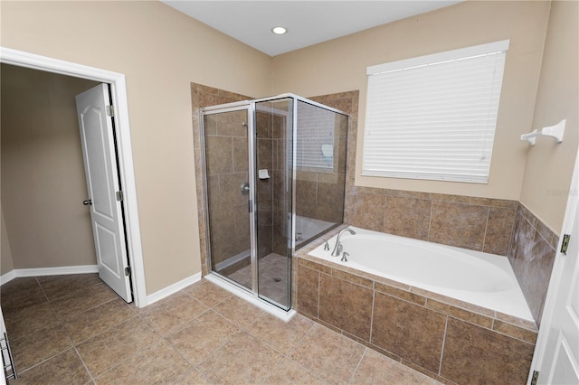 228 Magneta Loop, Auburndale, FL 33823 - bathroom with a bath, a stall shower, and tile patterned flooring