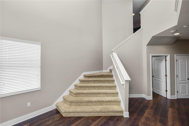 228 Magneta Loop, Auburndale, FL 33823 - staircase featuring wood finished floors and a towering ceiling