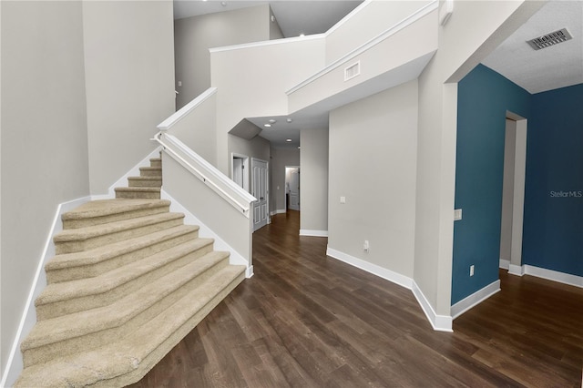 228 Magneta Loop, Auburndale, FL 33823 - stairs featuring wood finished floors and a high ceiling
