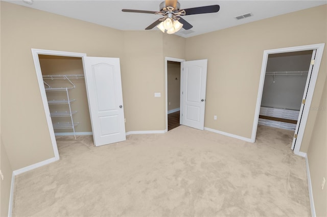 228 Magneta Loop, Auburndale, FL 33823 - unfurnished bedroom featuring a walk in closet, a closet, and carpet flooring