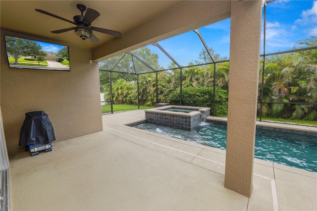 228 Magneta Loop, Auburndale, FL 33823 - view of patio / terrace featuring a ceiling fan, glass enclosure, and a pool with connected hot tub
