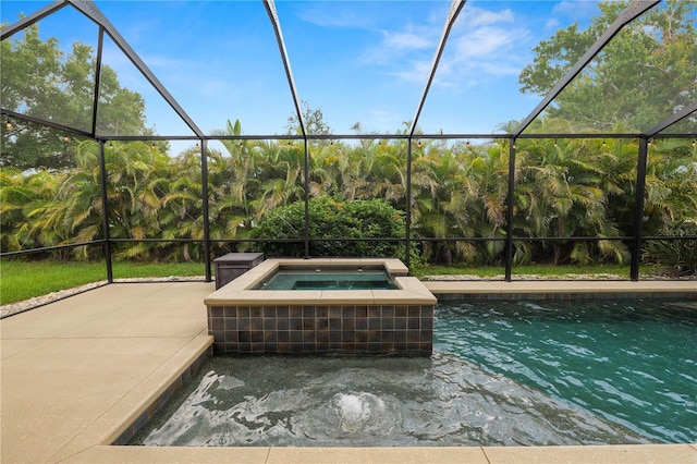 228 Magneta Loop, Auburndale, FL 33823 - view of swimming pool with a patio area, glass enclosure, and a pool with connected hot tub