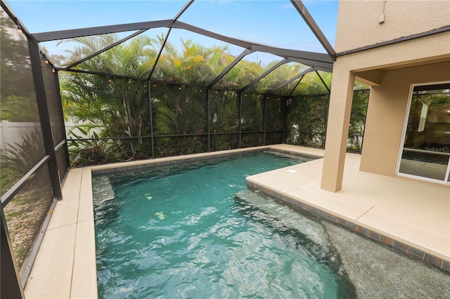 228 Magneta Loop, Auburndale, FL 33823 - outdoor pool featuring a patio area and glass enclosure