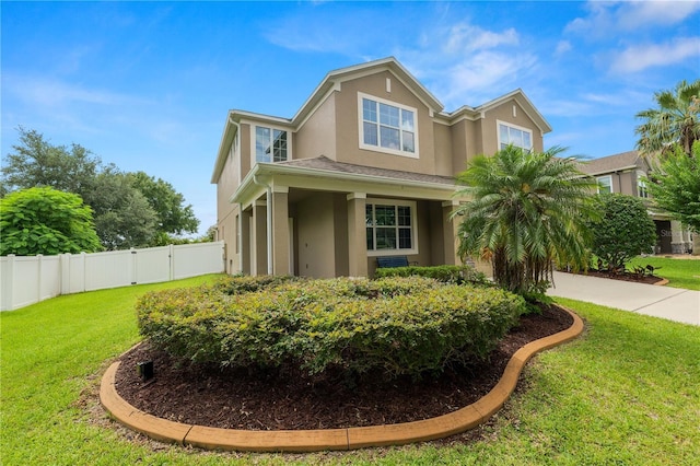 228 Magneta Loop, Auburndale, FL 33823 - view of front of home featuring stucco siding, concrete driveway, and a gate