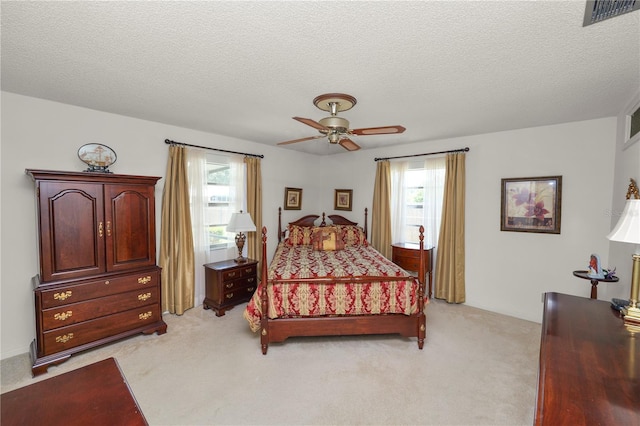 3315 Cross Fox Dr, Mulberry, FL 33860 - bedroom featuring light colored carpet, ceiling fan, and a textured ceiling