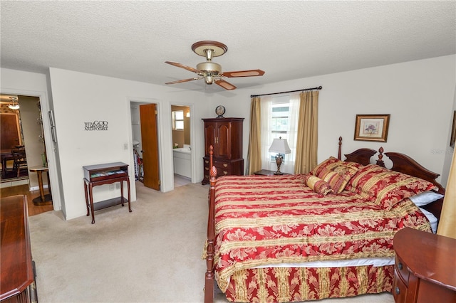 3315 Cross Fox Dr, Mulberry, FL 33860 - bedroom with washer / clothes dryer, light carpet, a textured ceiling, ensuite bathroom, and a ceiling fan