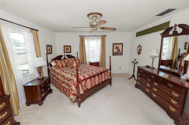 3315 Cross Fox Dr, Mulberry, FL 33860 - bedroom featuring light colored carpet, a textured ceiling, and ceiling fan