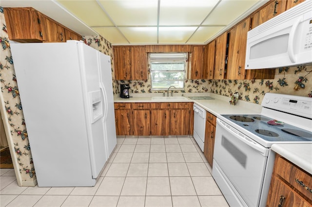 3315 Cross Fox Dr, Mulberry, FL 33860 - kitchen featuring white appliances, light countertops, and brown cabinets