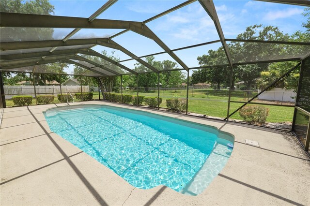 3315 Cross Fox Dr, Mulberry, FL 33860 - view of swimming pool featuring a fenced backyard, a patio area, and glass enclosure