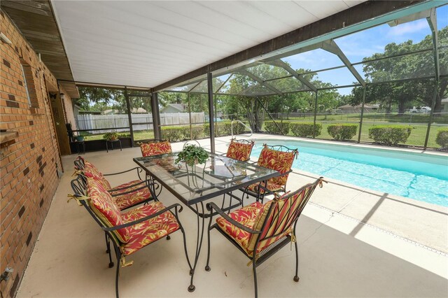 3315 Cross Fox Dr, Mulberry, FL 33860 - outdoor pool with a patio, glass enclosure, and outdoor dining space