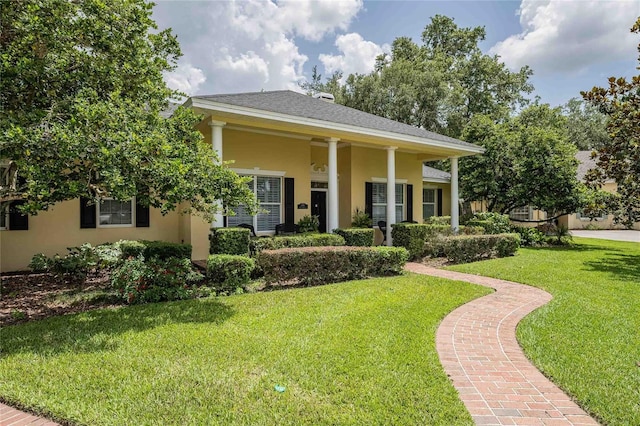 1589 Royal Forest Ct, Lakeland, FL 33811 - greek revival inspired property featuring stucco siding and a front lawn